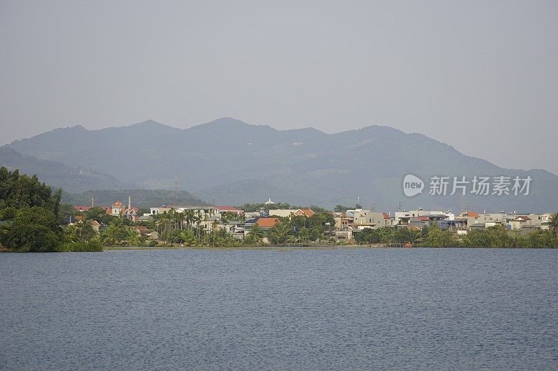 The peaceful village is located next to a large lake